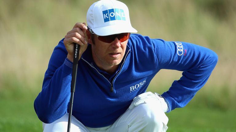 ASH, ENGLAND - OCTOBER 16:  Mikko Ilonen of Finland lines up a putt on the fifth hole during the first round matches of the Volvo World Match Play Champion