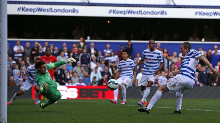 QPR defender Richard Dunne diverts the ball into his own net past