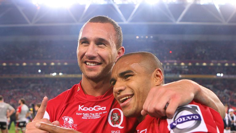 BRISBANE, AUSTRALIA - JULY 09: Quade Cooper and Will Genia of the Reds celebrate victory in the 2011 Super Rugby Grand Final match between the Reds and the