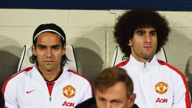 Substitutes Radamel Falcao and Marouane Fellaini of Manchester United take their seats