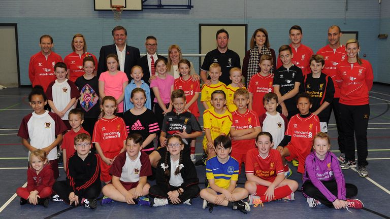 Jan Molby, Robbie Fowler and Margaret Aspinall with children from Liverpool FC Foundation partner schools.