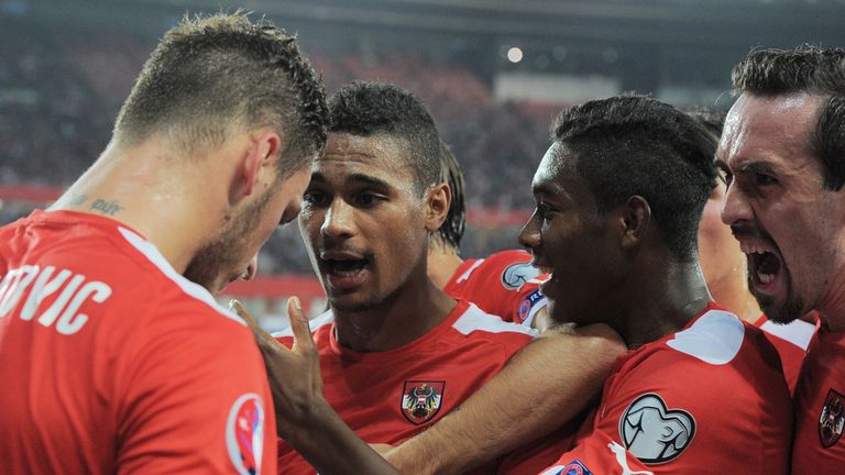 Austria's striker Rubin Okotie (2nd L) celebrates scoring