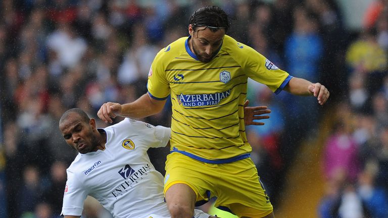 Sheffield Wednesday's Atdhe Nuhiu is tackled by Leeds United's Rodolph Austin during the Sky Bet Championship match at Elland Road, Leeds.