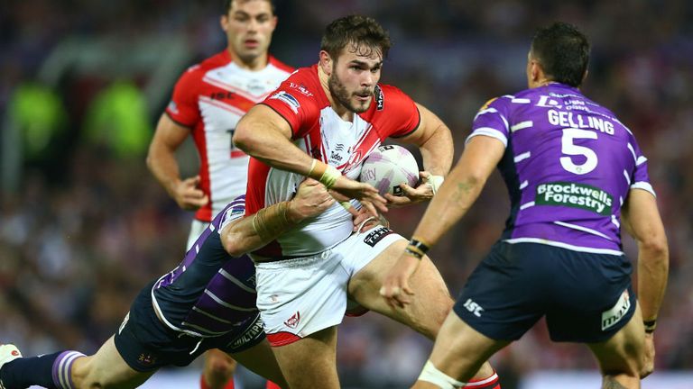 Alex Walmsley (C) of St Helens is held up during the First Utility Super League Grand Final