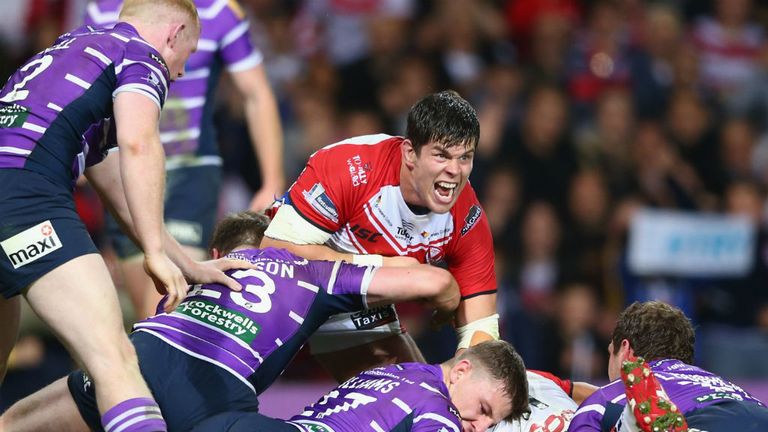 Louie McCarthy-Scarsbrook (C) of St Helens celebrates his sides opening try scored by Sia Soliola