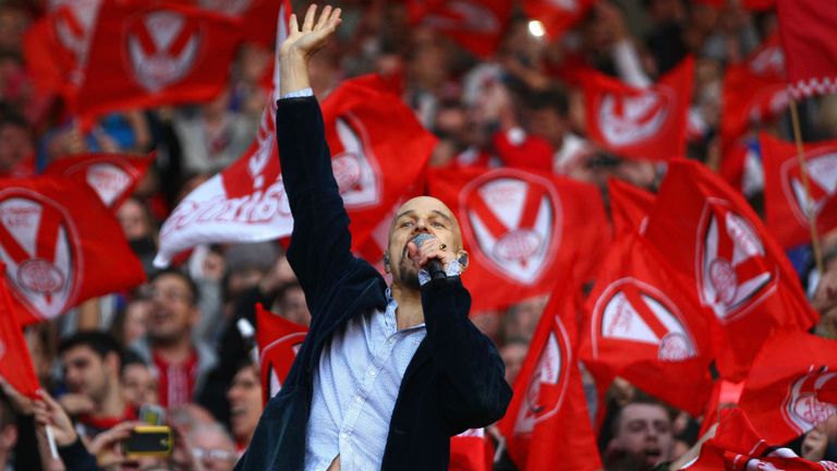 Tim Booth the lead singer of James performs amongst the supporters of St Helens ahead of the First Utility Super League Grand Final