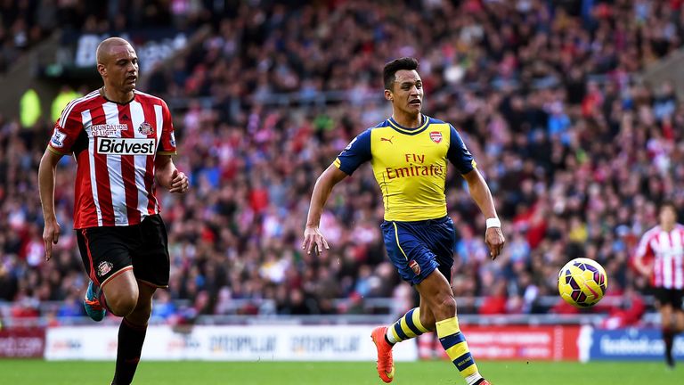 Alexis Sanchez pounces on a mistake from Wes Brown and is poised to fire Arsenal into the lead