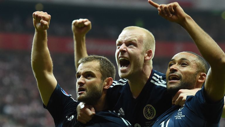 Shaun Maloney (left) celebrates with team-mates Steven Naismith (centre) and Ikechi Anya after equilising