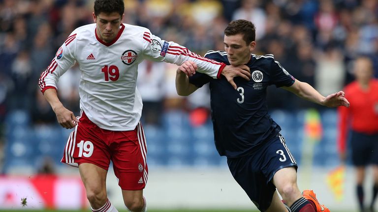 Scotland's Andrew Robertson (right) challenges Georgia's Giorgi Papava during the UEFA Euro 2016 qualifying match at Ibrox Stadium, Glasgow.