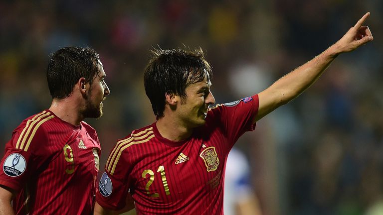 Spain's David Silva (R) celebrates after scoring
