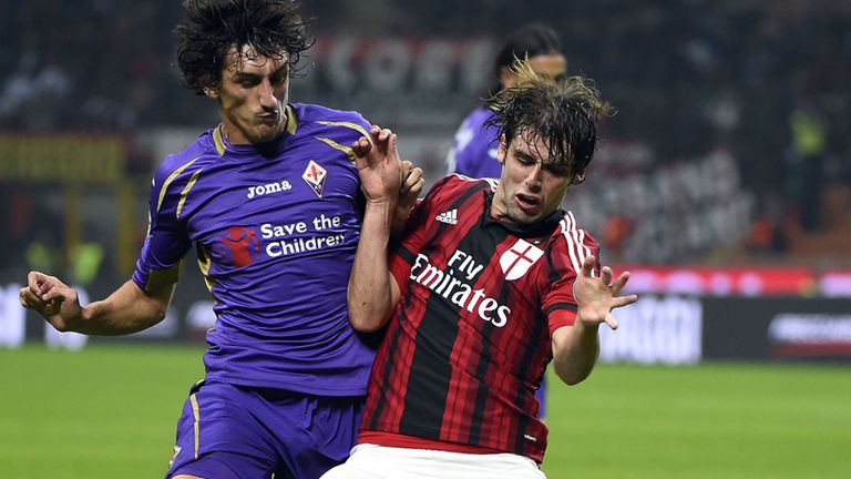 Fiorentina's Stefan Savic fights for he ball with AC Milan's Andrea Poli