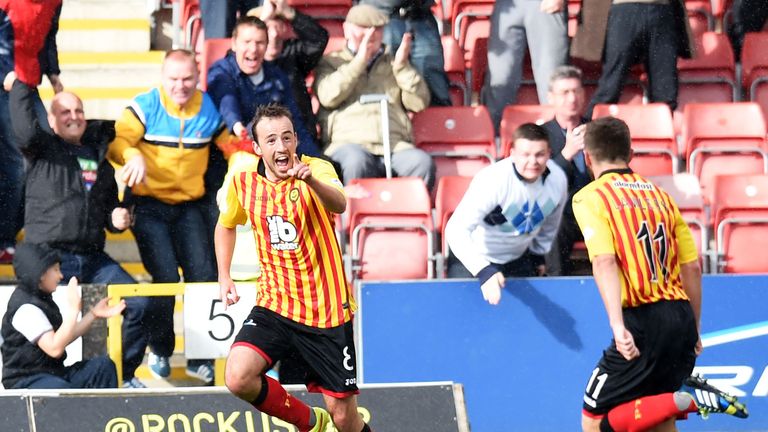 04/10/14 SCOTTISH PREMIERSHIP.PARTICK THISTLE v MOTHERWELL.FIRHILL - GLASGOW.Partick's Stuart Bannigan celebrates having put his side 1-0 to the good