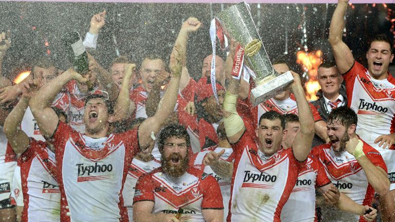 St Helens captain Paul Wellens lifts the trophy after winning the First Utility Super League Grand Final