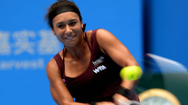 Heather Watson returns a shot against Venus Williams during their match at the 2014 China Open