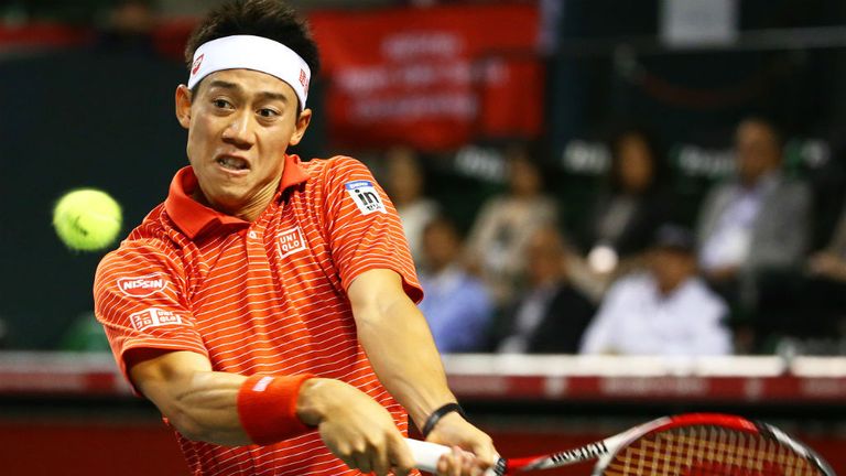 Kei Nishikori plays a shot against Donald Young during their second round match of the 2014 Japan Open