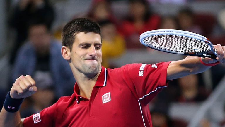 Novak Djokovic of Serbia celebrates winning the Men's Single Final on day nine of the China Open at the China National Tennis