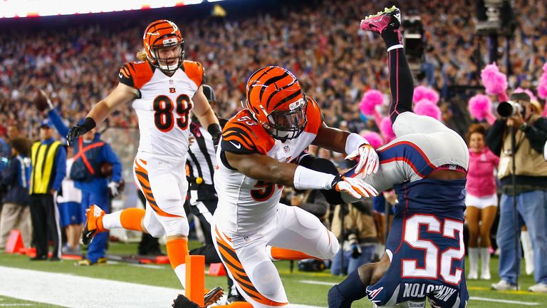 Kyle Arrington of the New England Patriots scores a touchdown after recovering a fumble against the Cincinnati Bengals