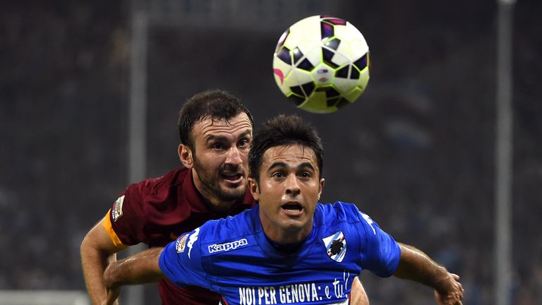 Roma's defender from Greece Vasilis Torosidis (L) fights for the ball with Sampdoria's forward from Brazil Eder