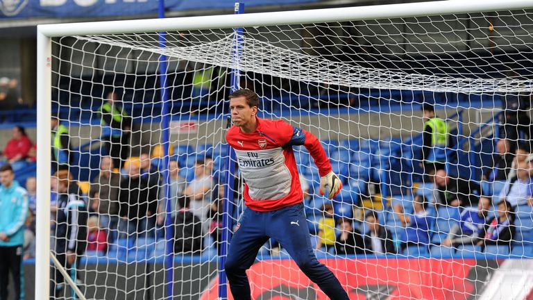 Arsenal's Wojciech Szczesny gathers practice shots before the game