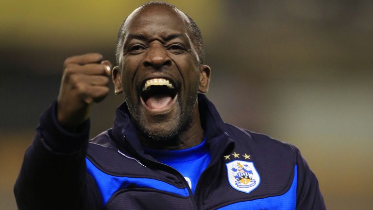 Huddersfield Town manager Chris Powell celebrates with fans after their 3-1 away win against Wolverhampton Wanderers