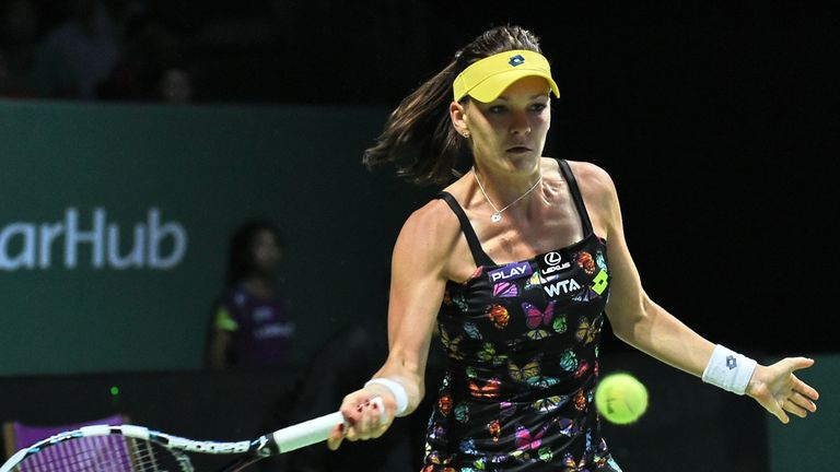 Agnieszka Radwanska of Poland returns a shot to Petra Kvitova of Czech Republic during the Women's Tennis Association (WTA) finals in Singapore on October 
