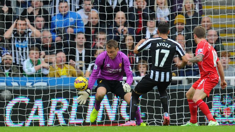 Newcastle striker Ayoze Perez fires the opening goal past Simon Mignolet after an Alberto Moreno mistake during the Premier League match against Liverpool
