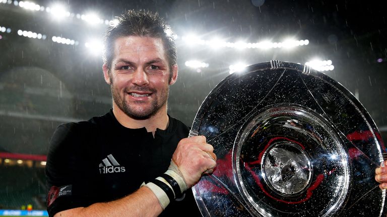 Richie McCaw of New Zealand poses with the trophy after the QBE International match between England and New Zealand