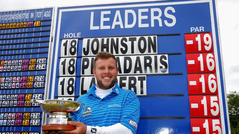 Andrew Johnston poses with the trophy after winning the 2014 Scottish Hydro Challenge