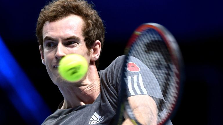 Britain's  Andy Murray returns to Japan's Kei Nishikori during their singles group B match on the first day of the