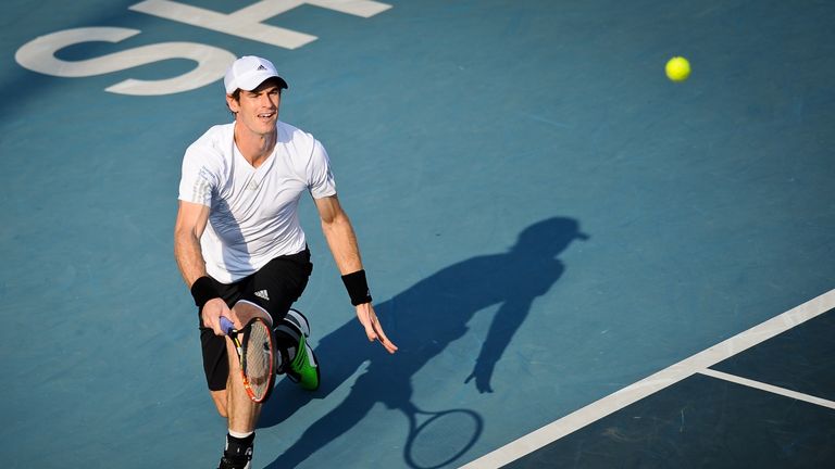 Andy Murray of Britain returns a shot against Juan Monaco of Argentina during their semifinal match at the Shenzhen Open tennis championship in Shenzhen, s