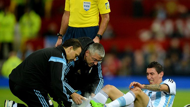 Argentina's Angel Di Maria is treated for an injury