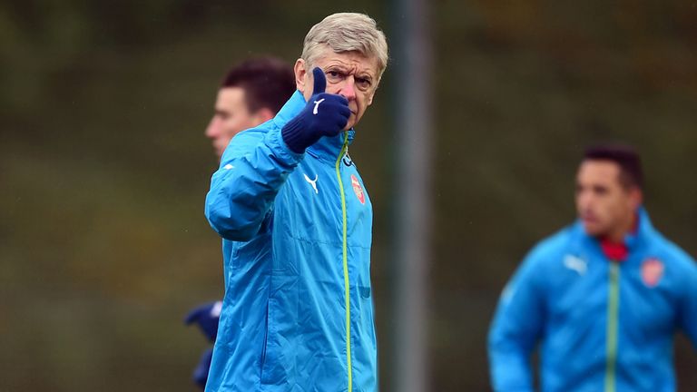 Arsenal's Manager Arsene Wenger gives the thumbs up during a training session at the Arsenal Training Centre, London Colney.