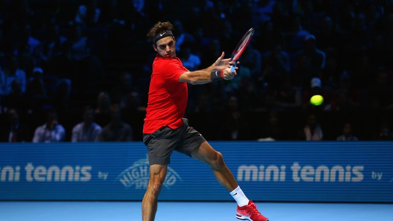 LONDON, ENGLAND - NOVEMBER 15: Roger Federer of Switzerland plays a forehand in the singles semi-final match against Stan Wawrinka of Switzerland on day se