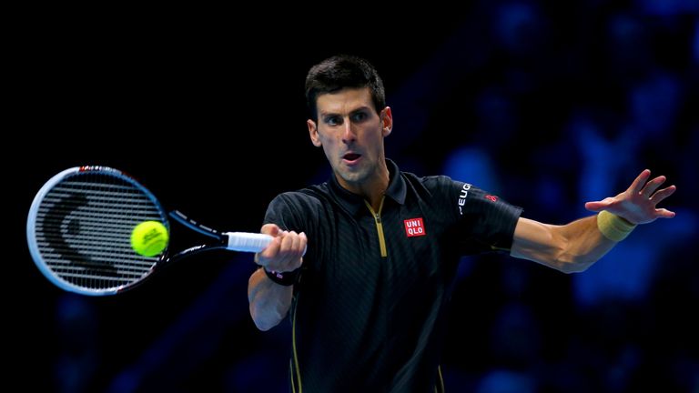Novak Djokovic plays a forehand in the singles match against Tomas Berdych on day six at the ATP World Tour Finals at the O2 Arena