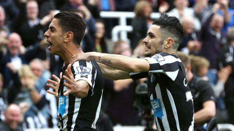 Ayoze Perez (L) celebrates scoring the opening goal with French midfielder Remy Cabella (R) during Newcastle's game with Liverpool.