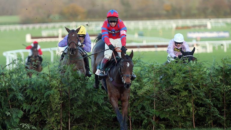 Balthazar King, ridden by Richard Johnson, jumps the last on the way to victory in the Glenfarclas Cross Country Chase.