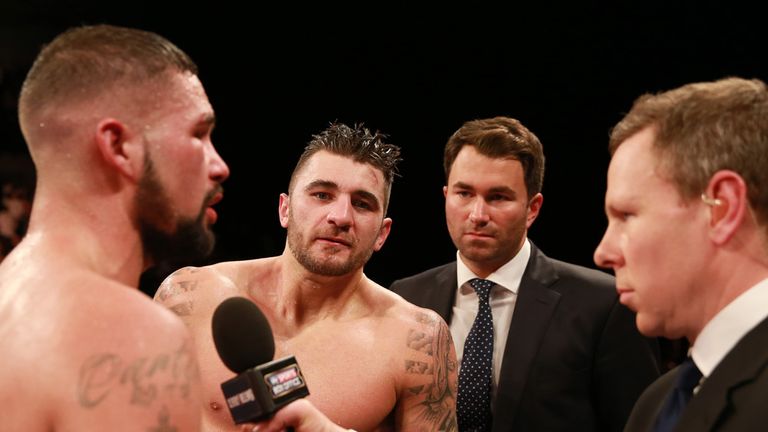 Tony Bellew is interviewed as Nathan Cleverly and Eddie Hearn watch on 