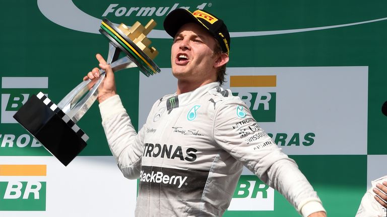 Race winner Nico Rosberg celebrates on the podium 