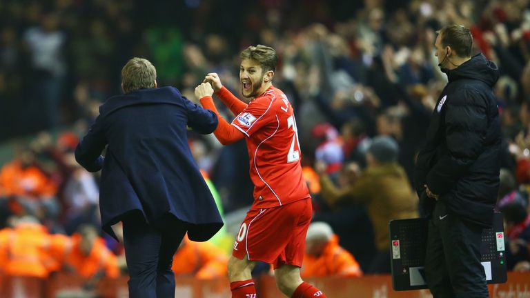 Brendan Rodgers celebrates with Adam Lallana after Glen Johnson (not pictured) scores the winning goal