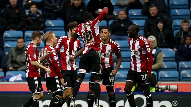 LONDON, ENGLAND - NOVEMBER 08:  Brentford celebrates with Andre Gray (2nd R) of Brentford after he scores to make it 1-0 during the Sky Bet Championship ma