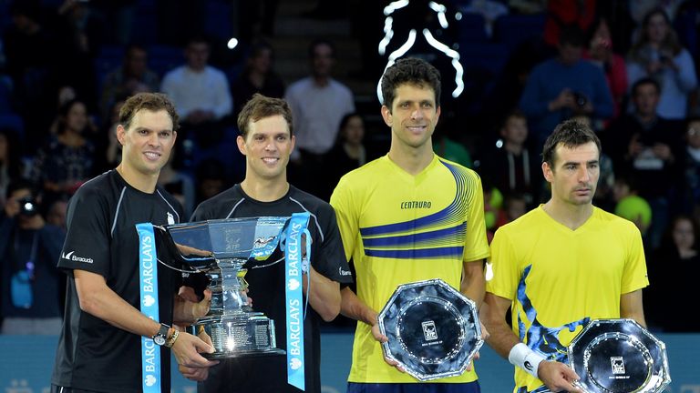 Winners Bob (L) and Mike Bryan (2nd L) and runners-up Croatia's Ivan Dodig (R) and Brazil's Marcelo Melo (2nd R) pose at the ATP World Tour finals
