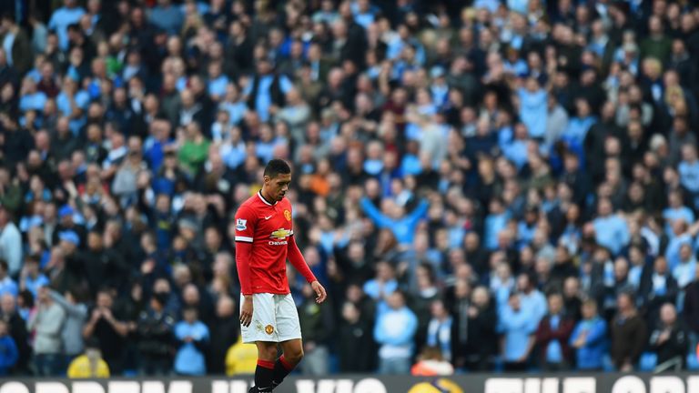 Chris Smalling of Manchester United leaves the field after receiving a red card during the first half at the Etihad.
