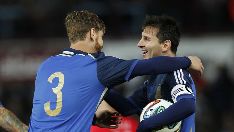 Christian Ansaldi celebrates after scoring an equalising goal with Argentina striker Lionel Messi