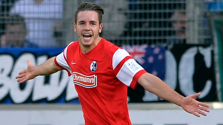 FREIBURG GERMANY - NOVEMBER 8: Christian Guenter of Freiburg celebrates his opening goal during the 