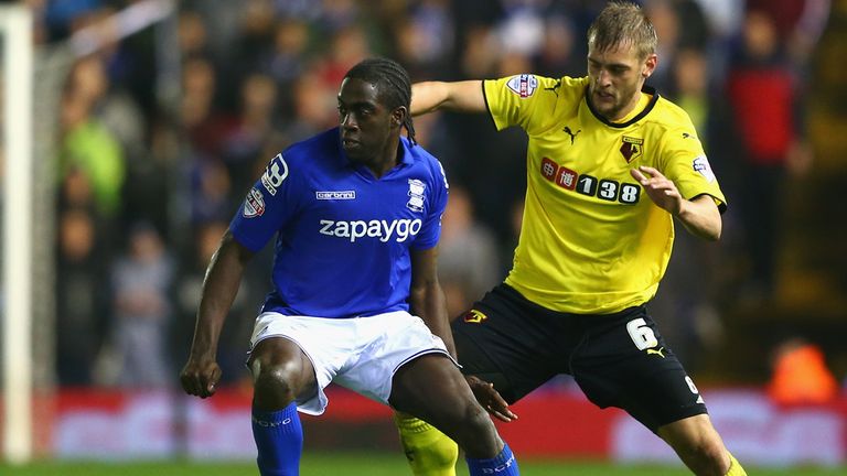 Clayton Donaldson (L) of Birmingham City is tracked by Joel Ekstrand (R) of Watford during the Sky Bet Championship match