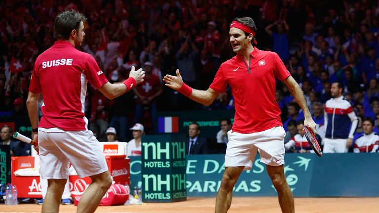 LILLE, FRANCE - NOVEMBER 22:  Roger Federer of Switzerland and Stanislas Wawrinka of Switzerland celebrate a point against Richard Gasquet of France and Ju