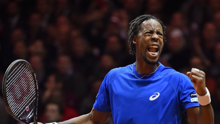 French tennis player Gael Monfils reacts during his match against Swiss tennis player Roger Federer, the second of the Davis Cup final, at the Stade Pierre