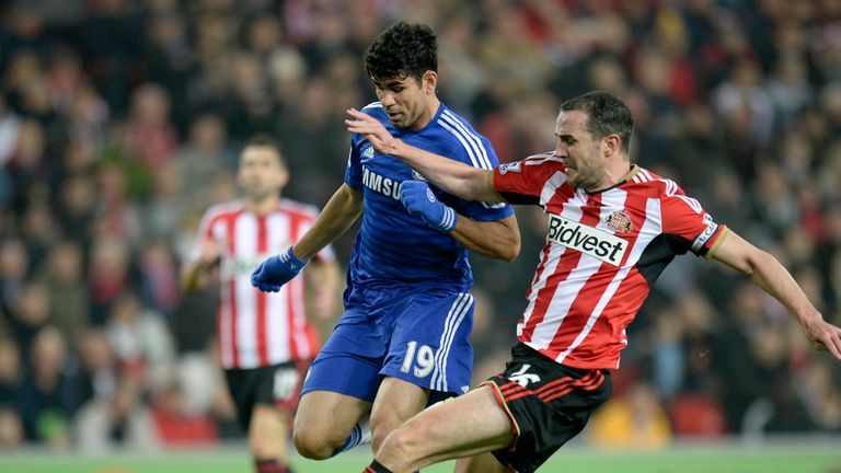 Chelsea's Diego Costa (left) battles for the ball with Sunderland's John O'Shea