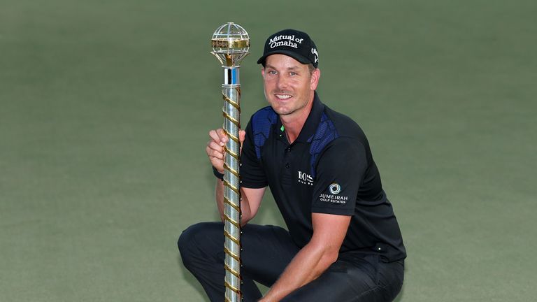 Henrik Stenson poses with the trophy 