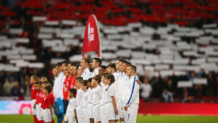 England and Slovenia players line up prior to the EURO 2016 Qualifier Group E match between England and Slovenia at Wembley